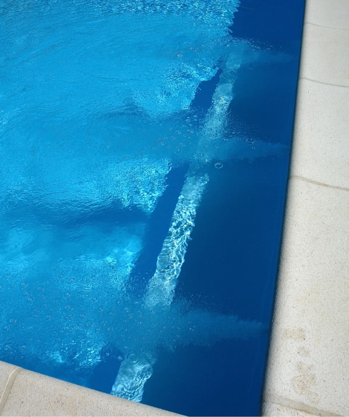 Swimming pool edge with water ripples