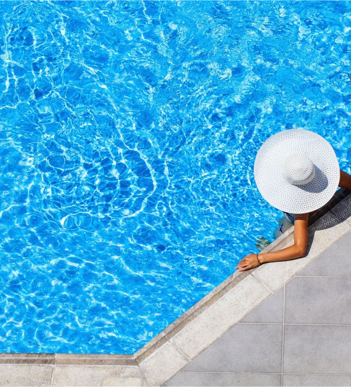 Person relaxing by the poolside